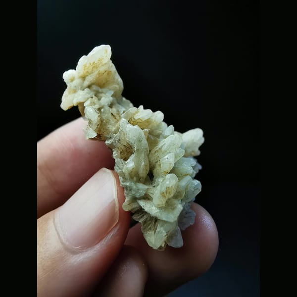 Floater cluster of off-white dogtooth calcite — alternate view