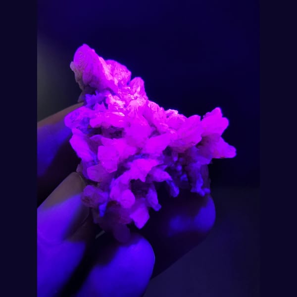 Floater cluster of off-white dogtooth calcite — detail view