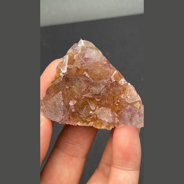 Glassy amber-brown fluorite crystal group from Zhejiang — complete view