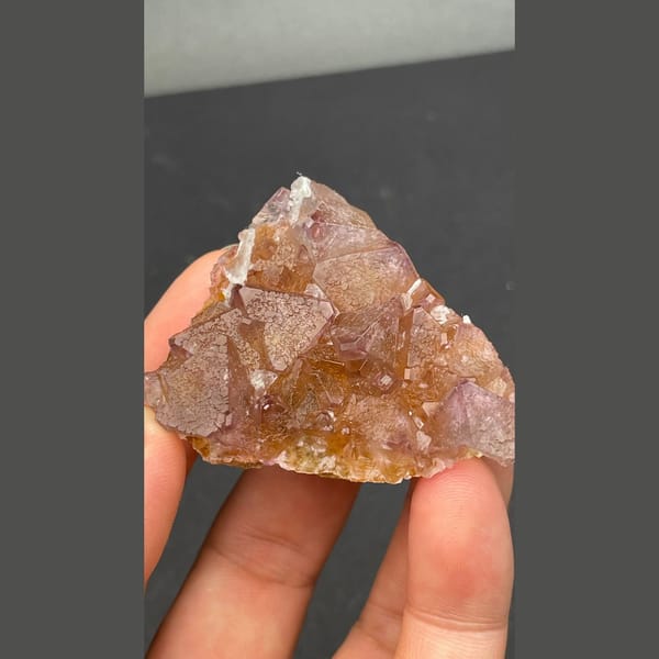 Glassy amber-brown fluorite crystal group from Zhejiang — alternate view