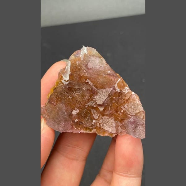 Glassy amber-brown fluorite crystal group from Zhejiang — alternate view