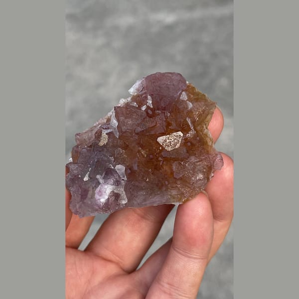 Rose purple transparent fluorite cluster from Zhejiang — detail view