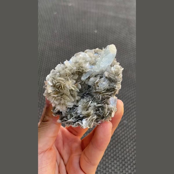 Pale blue aquamarine crystals on silvery mica from Xuebaoding, Sichuan — alternate view