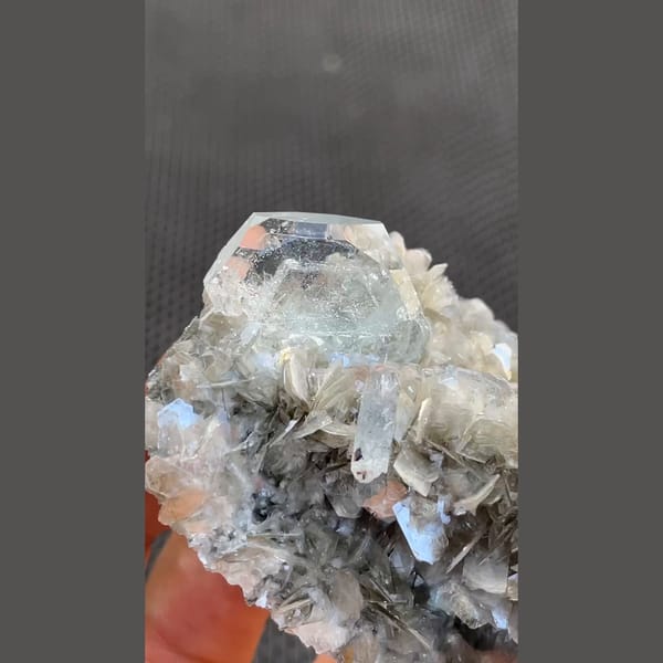 Pale blue aquamarine crystals on silvery mica from Xuebaoding, Sichuan — detail view