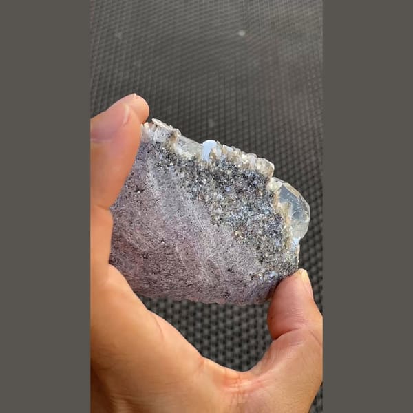 Pale blue aquamarine crystals on silvery mica from Xuebaoding, Sichuan — detail view