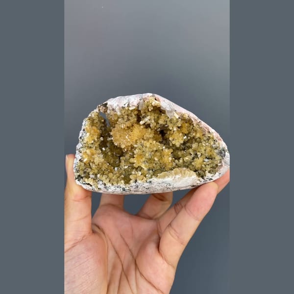 Pocket lined with yellow stilbite sprays from Yunxiao, Fujian — complete view