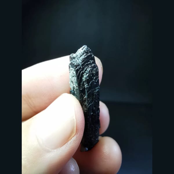 Etched black ilvaite crystal with tiny quartz — alternate view