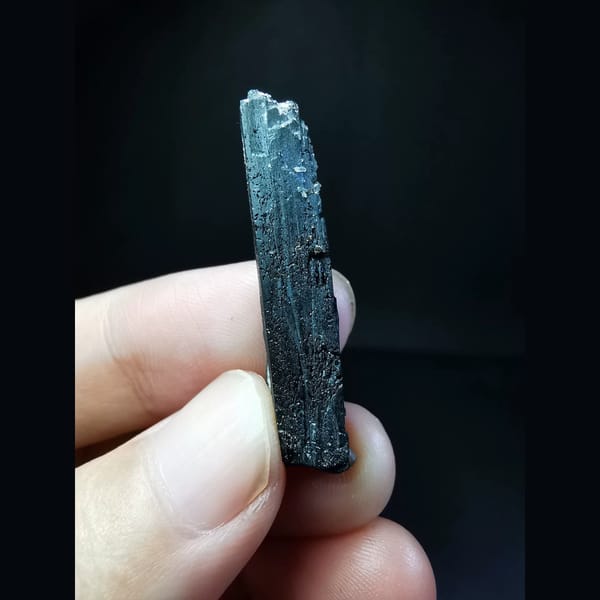 Etched black ilvaite crystal with tiny quartz — alternate view