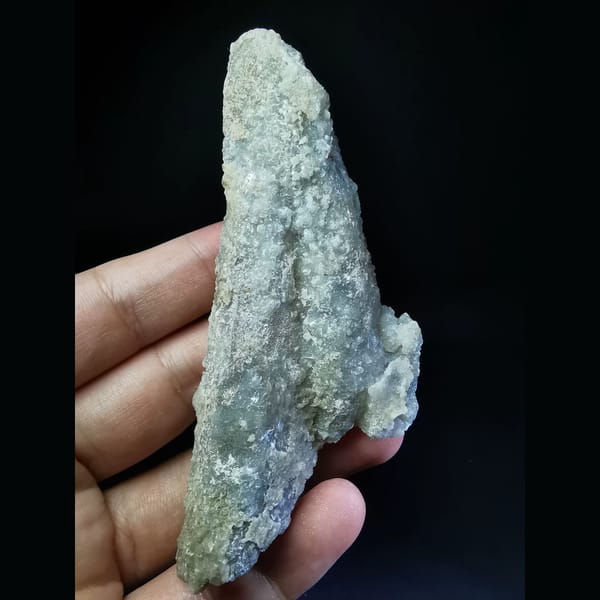 Floater quartz with a thin calcite coat — complete view