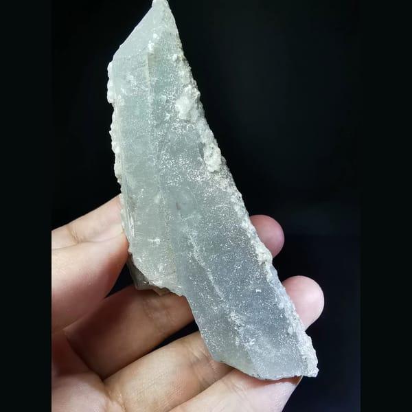 Floater quartz with a thin calcite coat — alternate view