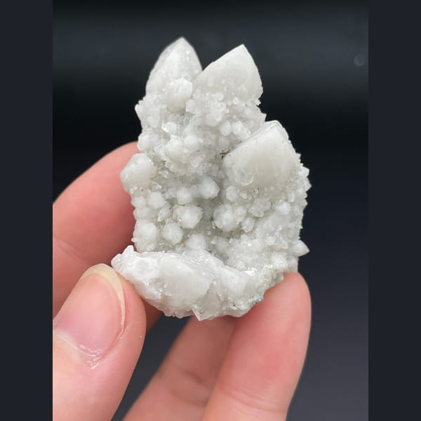 Small cluster of milky white quartz points from Inner Mongolia — complete view