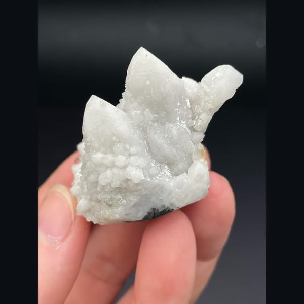 Small cluster of milky white quartz points from Inner Mongolia — alternate view