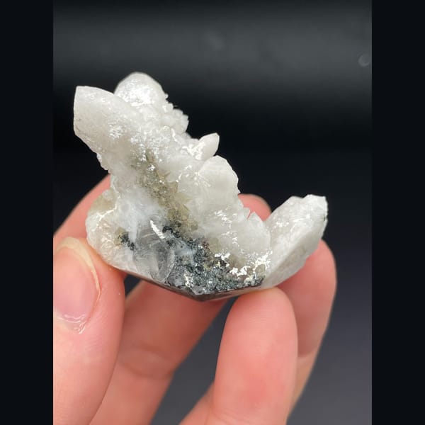 Small cluster of milky white quartz points from Inner Mongolia — detail view