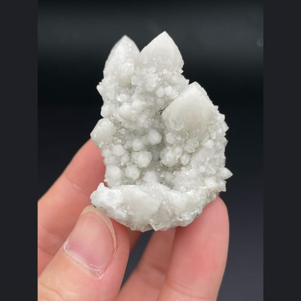 Small cluster of milky white quartz points from Inner Mongolia — detail view