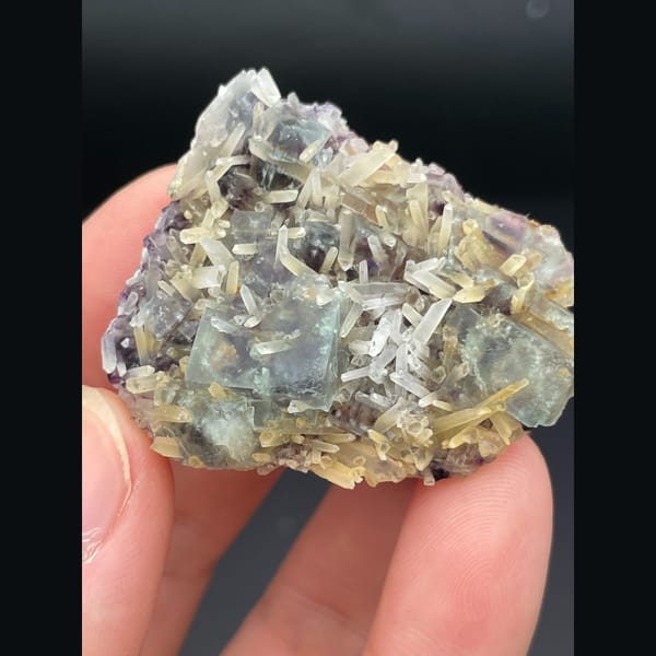 Pale green fluorite with quartz crystals from Inner Mongolia — detail view