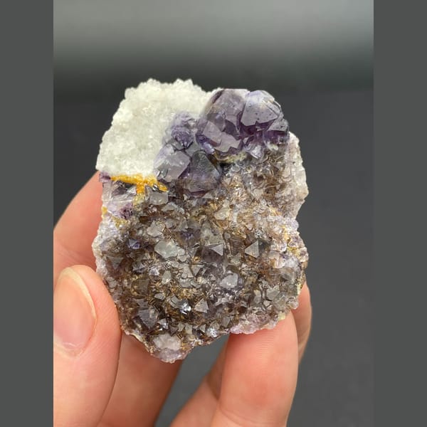 Deep purple fluorite cubes on brown matrix from Inner Mongolia — alternate view
