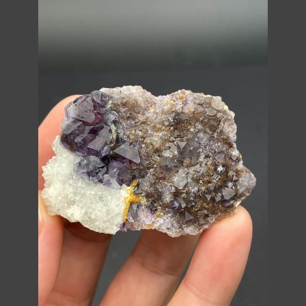 Deep purple fluorite cubes on brown matrix from Inner Mongolia — alternate view