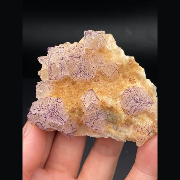 Pink lavender fluorite plate with patterned orange coating from Guizhou — complete view