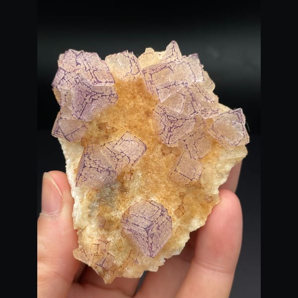 Pink lavender fluorite plate with patterned orange coating from Guizhou — alternate view