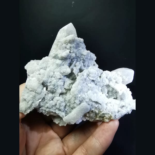 Quartz cluster with sparkling white calcite plates — complete view