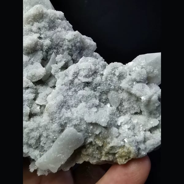 Quartz cluster with sparkling white calcite plates — detail view
