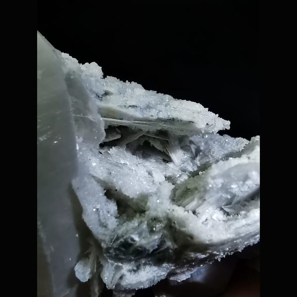 Quartz cluster with sparkling white calcite plates — detail view