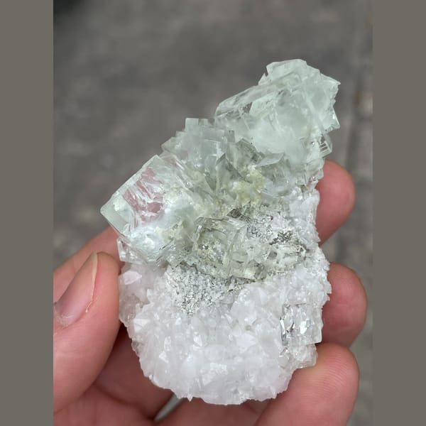 Clear mint green fluorite on white matrix from Xianghuapu — detail view
