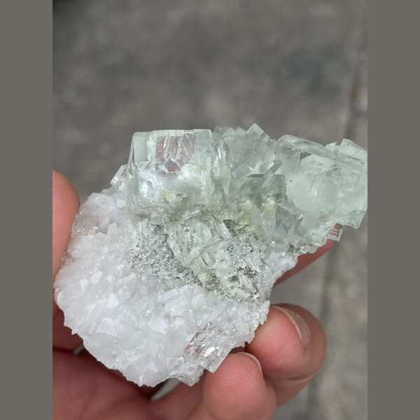 Clear mint green fluorite on white matrix from Xianghuapu — detail view