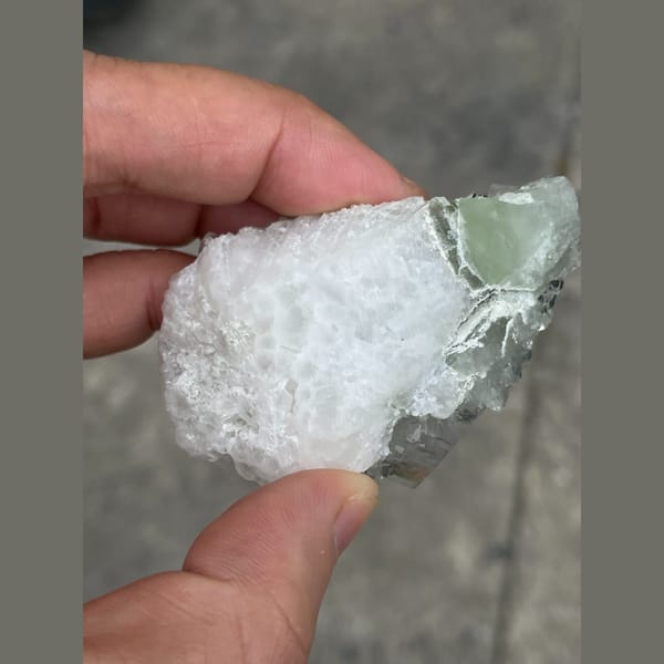 Clear mint green fluorite on white matrix from Xianghuapu — detail view