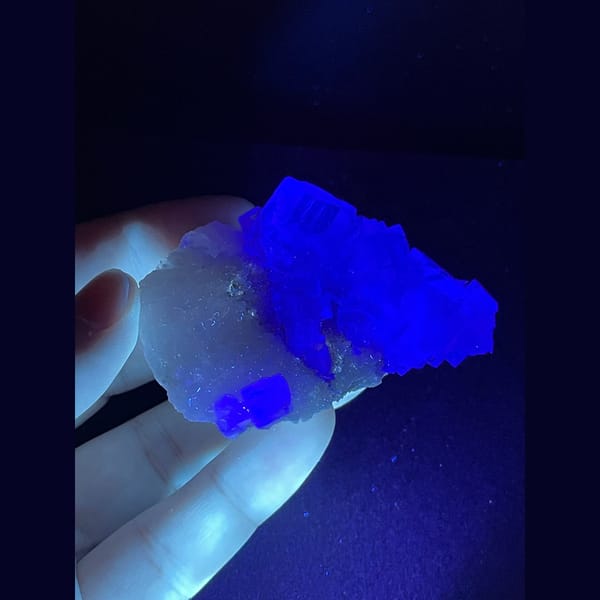 Clear mint green fluorite on white matrix from Xianghuapu — detail view