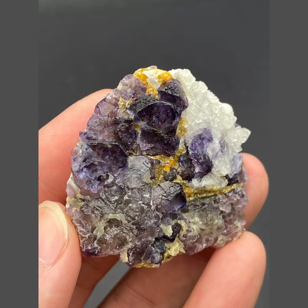 Purple fluorite cubes with golden accents from Inner Mongolia — complete view