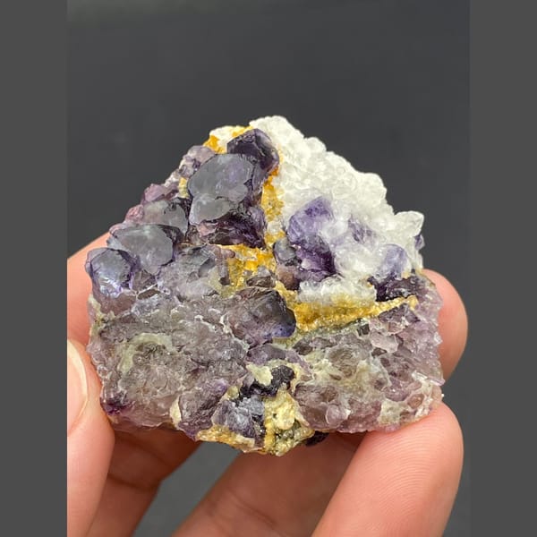 Purple fluorite cubes with golden accents from Inner Mongolia — detail view