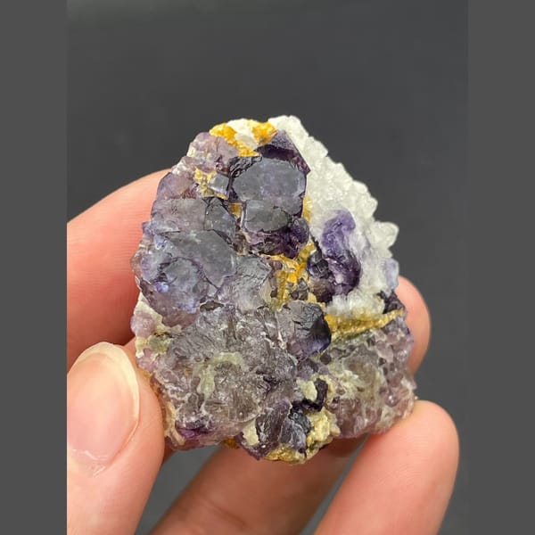 Purple fluorite cubes with golden accents from Inner Mongolia — detail view