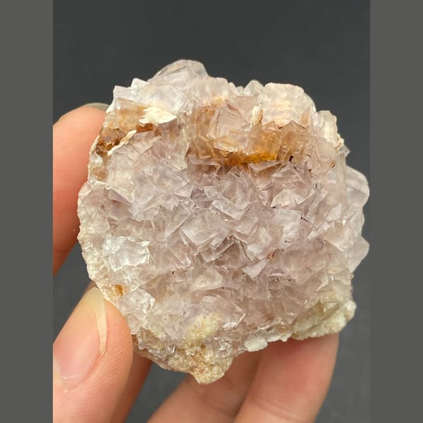 Cluster of pale pink fluorite crystals from Guizhou — alternate view