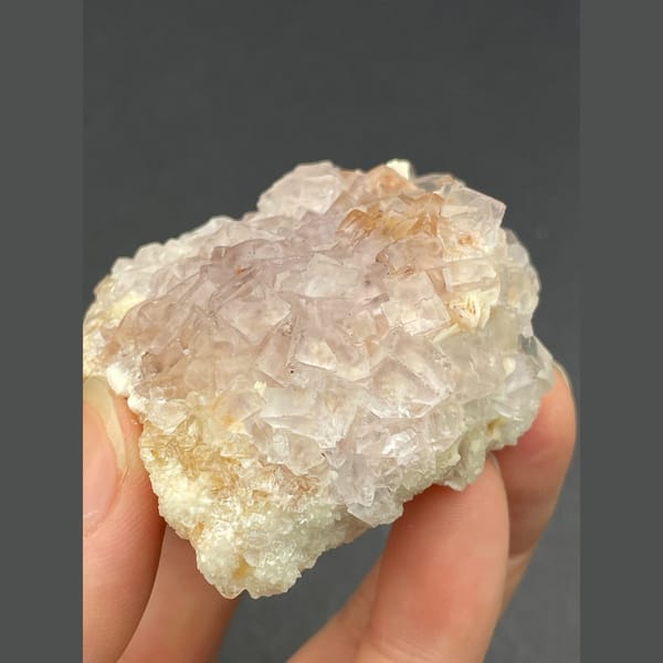 Cluster of pale pink fluorite crystals from Guizhou — alternate view