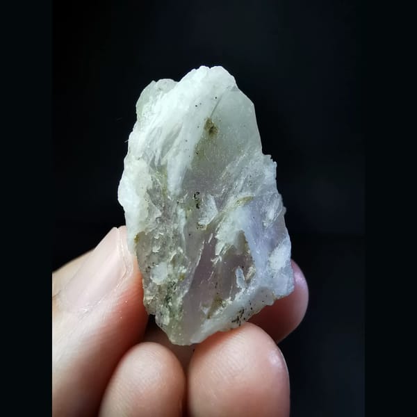 Slightly purple calcite-interference quartz — detail view