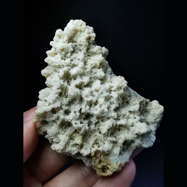 Naturally etched off-white calcite — complete view