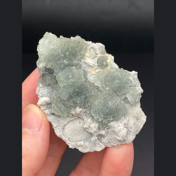 Pale green fluorite on white sugary matrix from Fujian — detail view