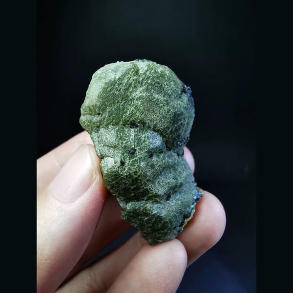 Green andradite garnet specimen — complete view