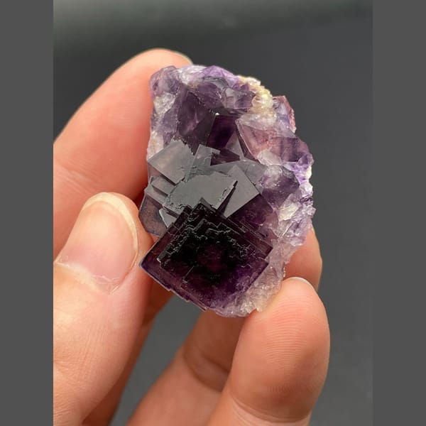 Deep purple cubic fluorite cluster from Anhui — complete view