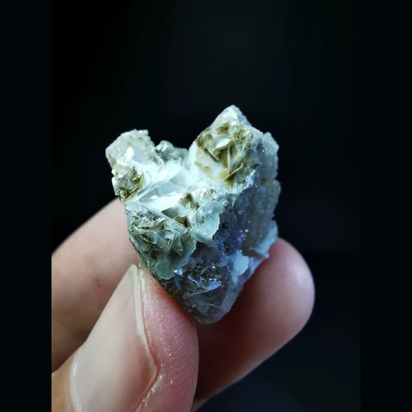 Sparkly small quartz cluster with calcite — alternate view