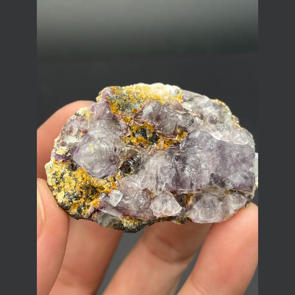 Pale lavender fluorite cubes on golden matrix from Inner Mongolia — alternate view