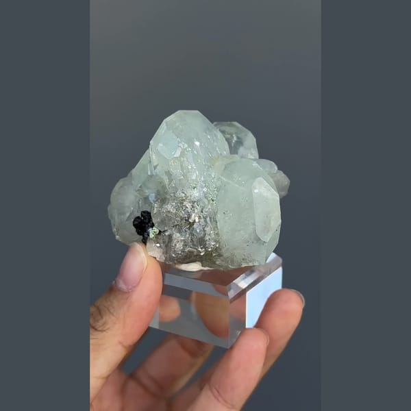 Pale green-blue aquamarine with black cassiterite from Xuebaoding, Sichuan — alternate view