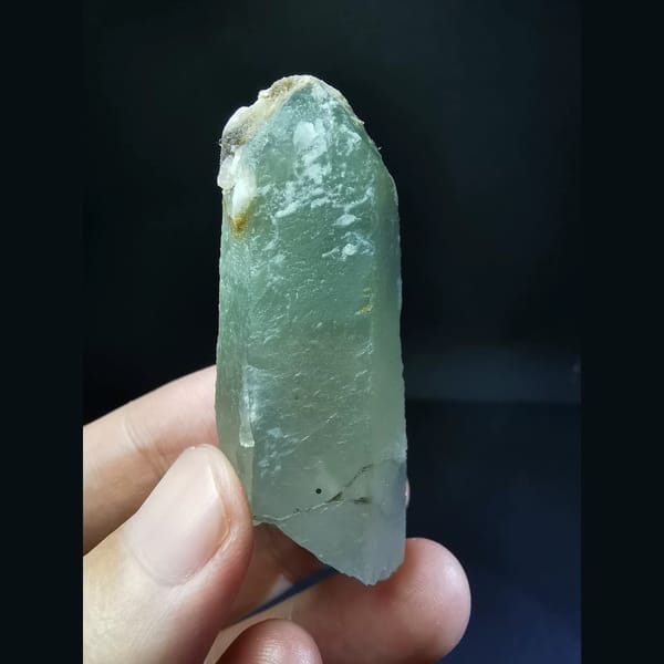 Quartz with a green inclusion at the tip — alternate view