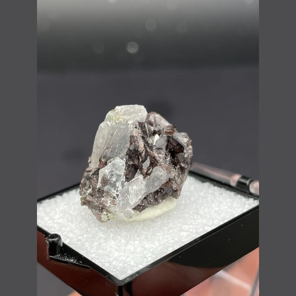 Small brown axinite crystals with quartz from Pakistan — detail view
