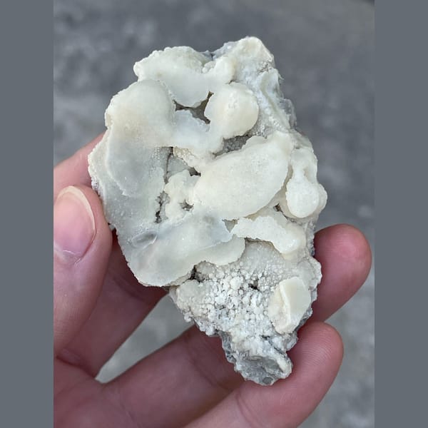 Rounded white calcite cluster from Yunnan — complete view