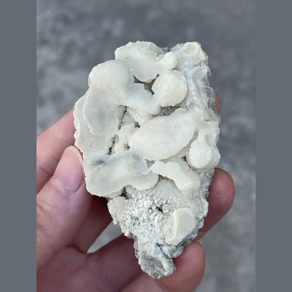 Rounded white calcite cluster from Yunnan — alternate view