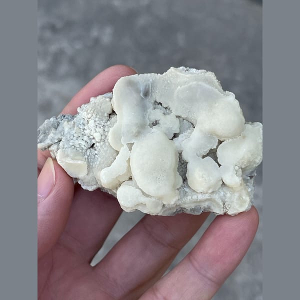 Rounded white calcite cluster from Yunnan — alternate view