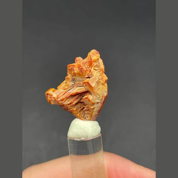 Skeletal red-orange vanadinite crystal group from Morocco — detail view