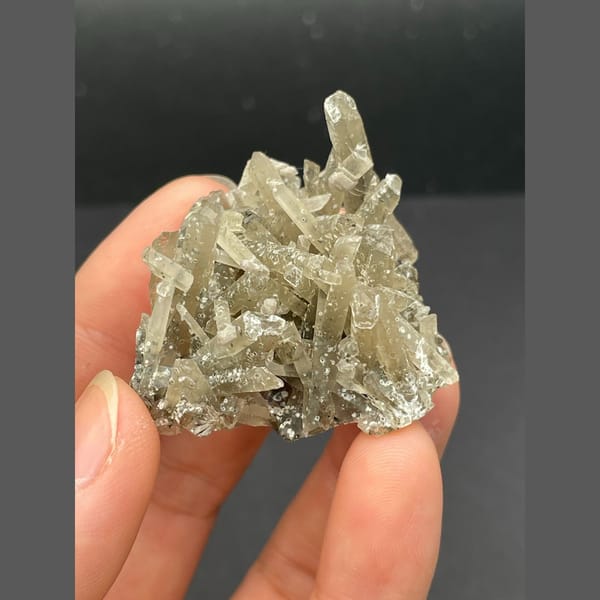 Spray of slender grey quartz crystals from Inner Mongolia — complete view